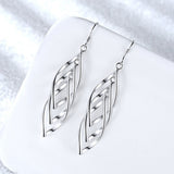 Boucles d'oreilles Solenne Woven Wave | Or blanc