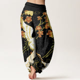 Pantalon harem motifs grues et fleurs
