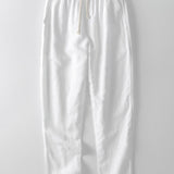 Chemise en maille ajourée et pantalon droit en lin
