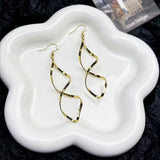 Boucles d'oreilles pendantes en spirale | Dorées