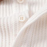 Polo gaufré à bordure contrastante et pantalon fuselé coupe slim