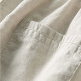 Chemise boutonnée en maille rayée et pantalon droit en lin