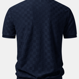 Polo en maille à col en V à motif damier et pantalon fuselé coupe slim