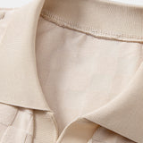 Polo en maille à col en V à motif damier et pantalon fuselé coupe slim