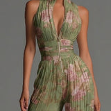 Combinaison ample en mousseline plissée verte à motif floral, encolure en V, sans manches et fermeture éclair.
