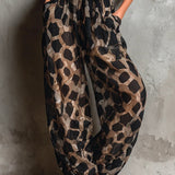 Combinaison pantalon large en mousseline à imprimé animal noir et dos nu