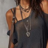 Blouse en tricot à épaules asymétriques rétro