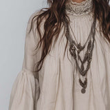 Blouse en coton et lin plissée à garniture en dentelle